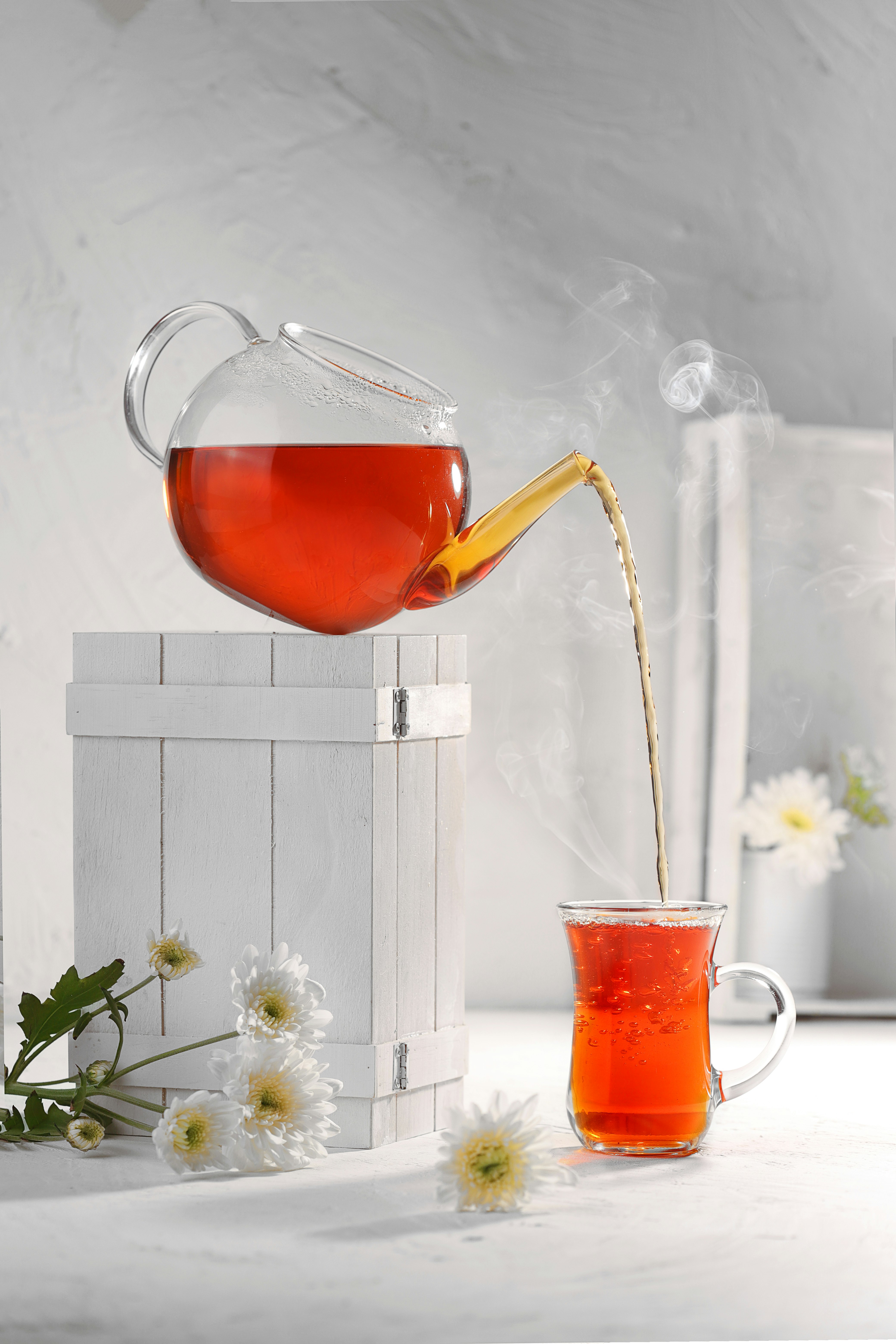 clear glass mug with brown liquid